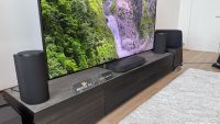 The Sony Bravia Theatre Trio sound system, picture on a low AV rack alongside an 85-inch Sony Bravia 9 II TV