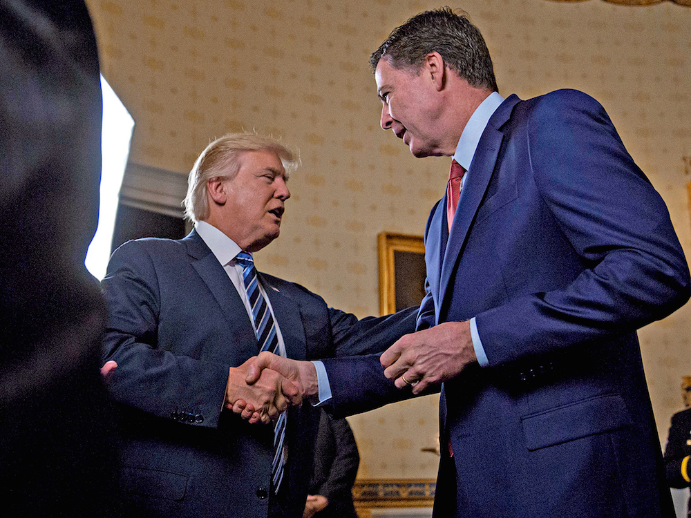 Donald Trump shaking hands with James Comey