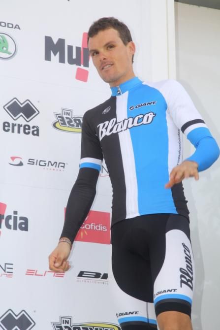 Luis Leon Sanchez (Blanco) steps on stage for the podium ceremony