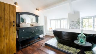 traditional bathroom with sloping ceiling and vanity unit