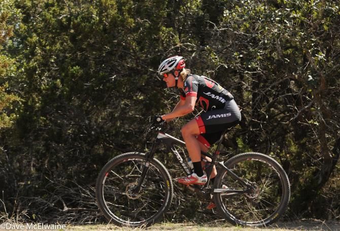 Erica Tingey (Team Jamis) riding through the thick trees on her way to a ninth place finish