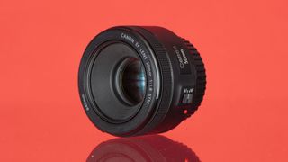Canon 50mm lens on red background