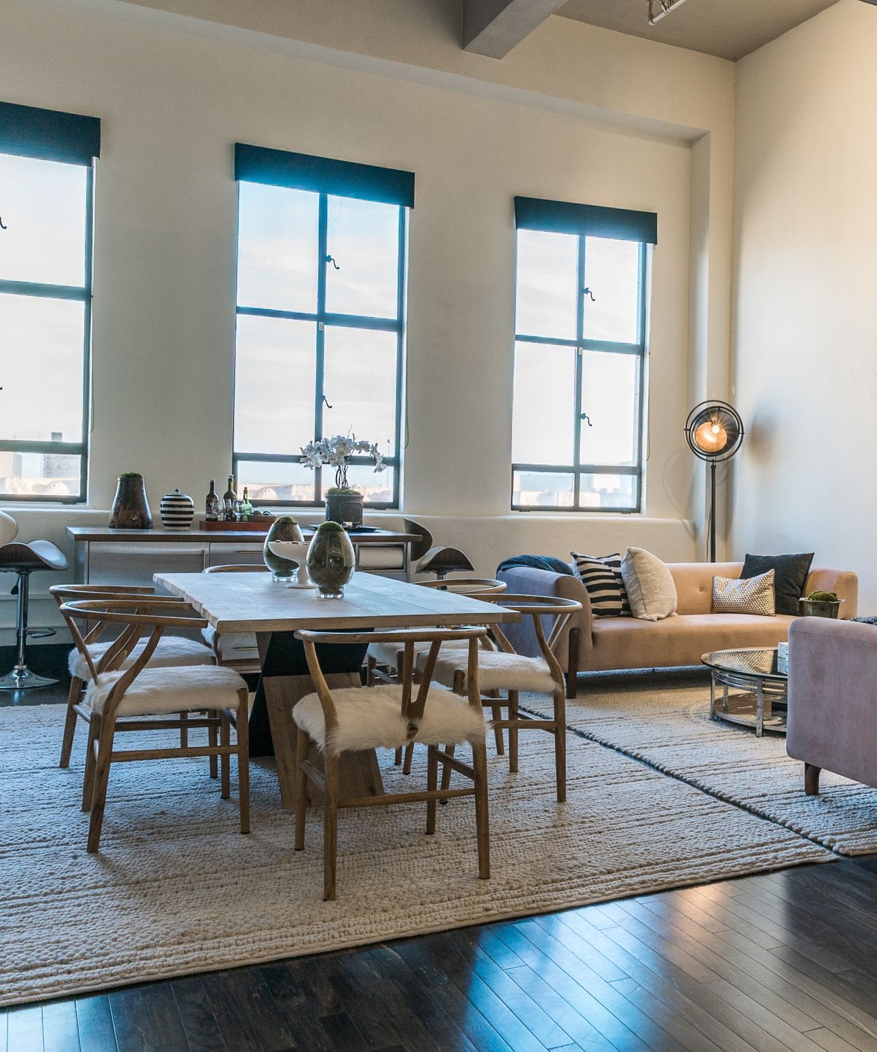 Dining table with ornaments and textured chairs