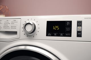 close up of dials on hotpoint washing machine by AO