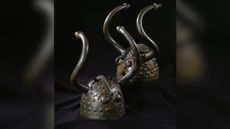 The two Viks&oslash; helmets were found in pieces a bog in eastern Denmark in 1942. Archaeologists think they were deliberately deposited there as religious offerings.