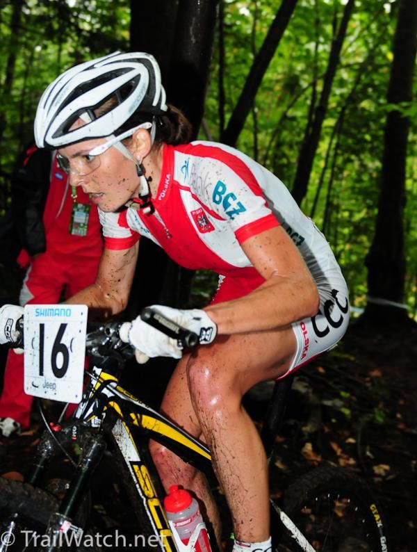 Maja Wloszcowska (Poland) leading in the woods on lap two.