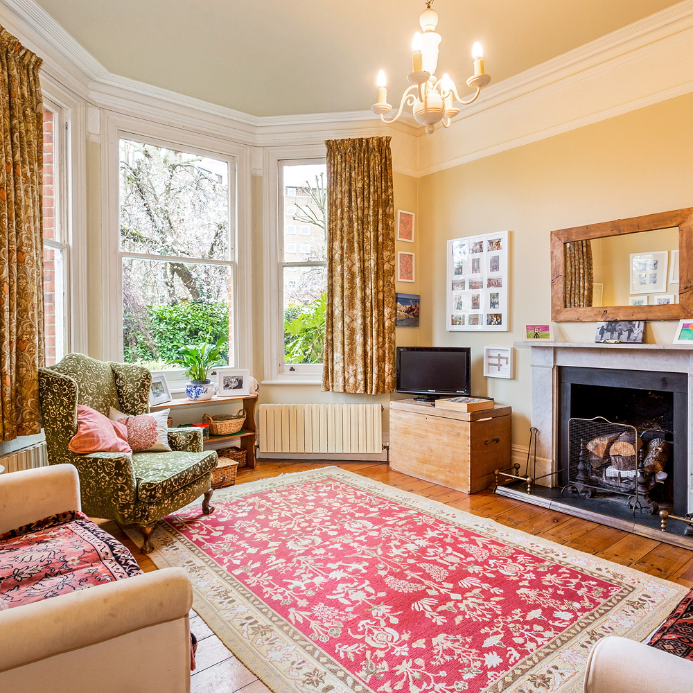 living room with wooden flooring with fireplace