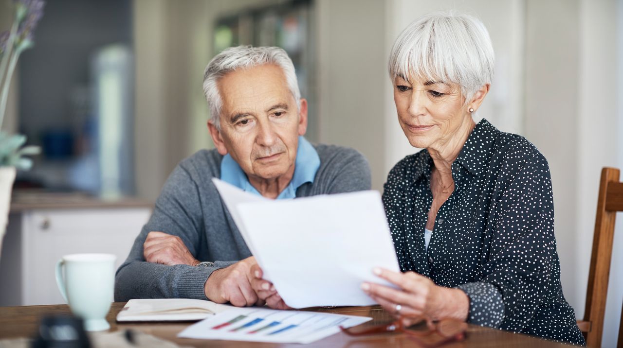 A couple looking at some paper work together