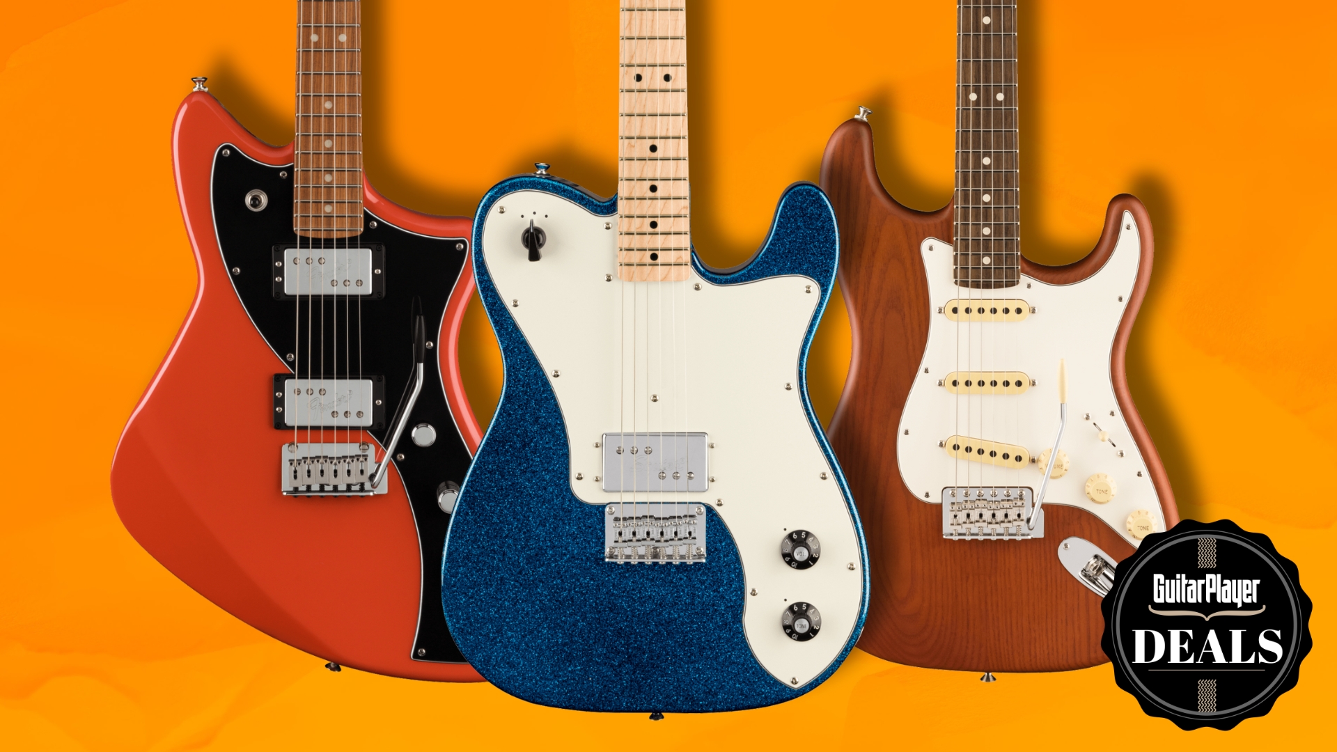 Three Fender guitars on an orange background
