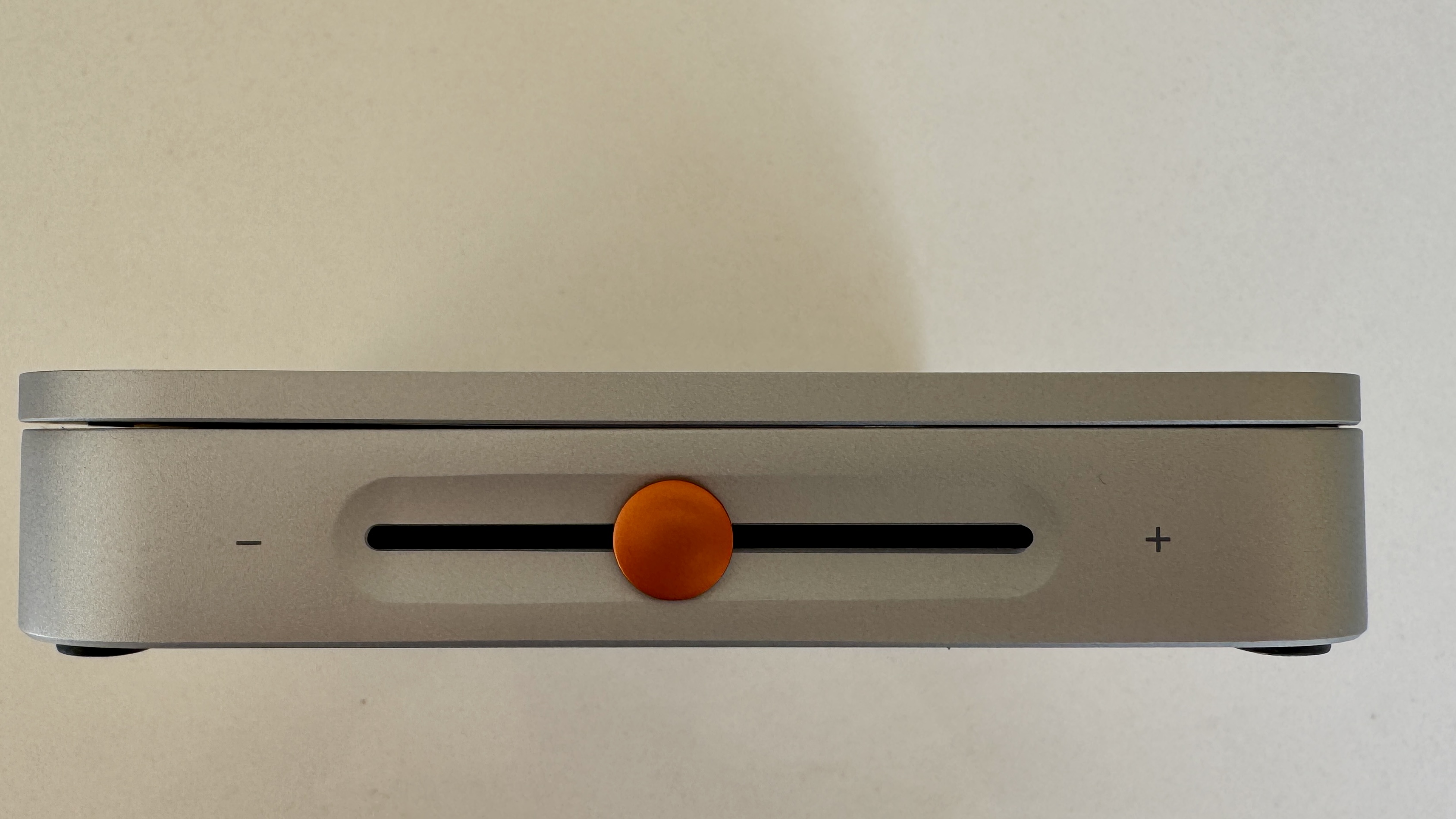 Orange volume control slider on the side panel of the Fosi Audio Merak CD player