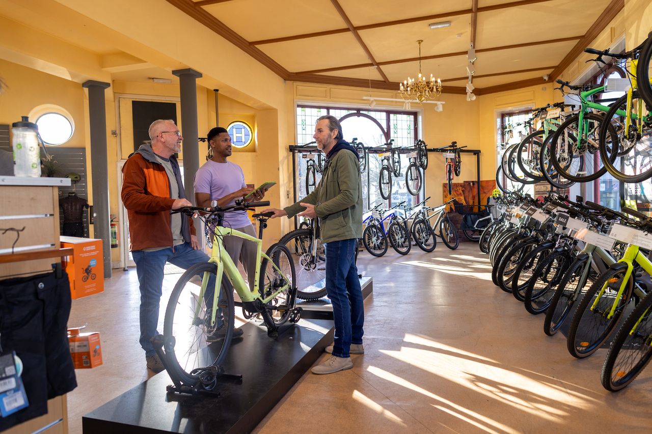 Male customer looking at a bike in a bike shop