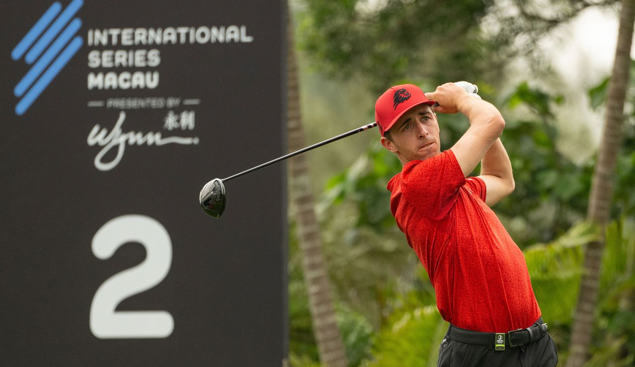 David Puig hits a driver in front of a International Series Macau sign