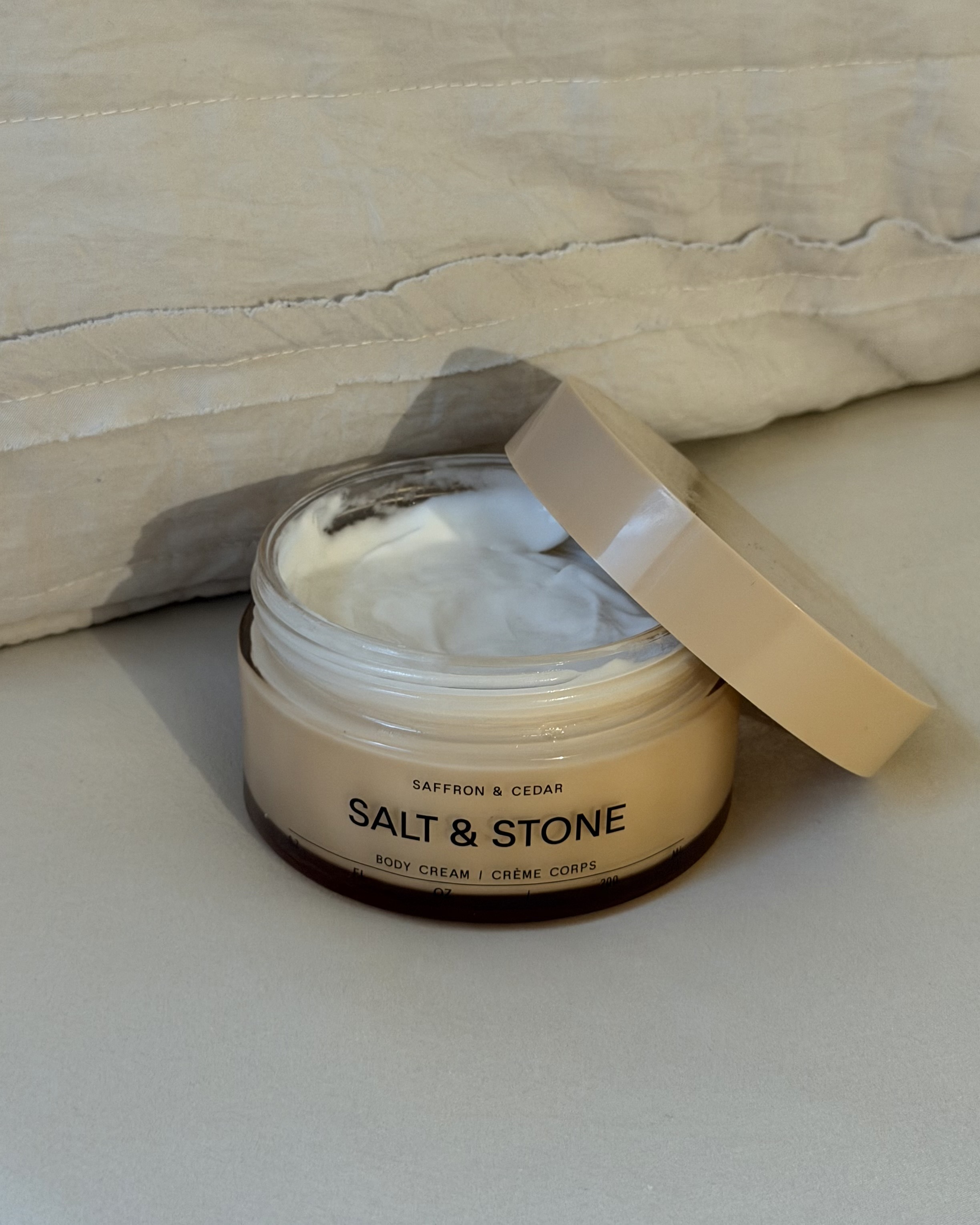 An image of associate beauty editor Alyssa Brascia's Salt &amp;amp; Stone Saffron and Cedar Body Cream.
