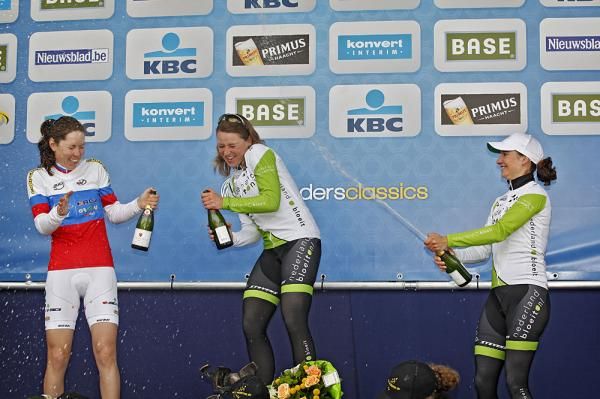 Marianne Vos shoots her teammate Annamiek Van Vleuten with the champagne spray