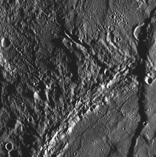 As the Messenger team continues to study the high-resolution images taken during the Mercury flyby encounter on Jan. 14, 2008, scarps (cliffs) that extend for long distances are discovered. This frame, taken by the Narrow Angle Camera (NAC) of the Mercury