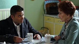 Fatboy and Dot Branning taking at the kitchen table in EastEnders 