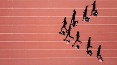 Top-down shot of track runners in training