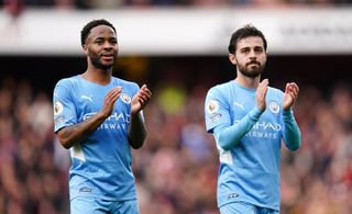 Manchester City’s Raheem Sterling (left) and Bernardo Silva applaud the fans after the Premier League match at the Emirates Stadium, London. Picture date: Saturday January 1, 2022