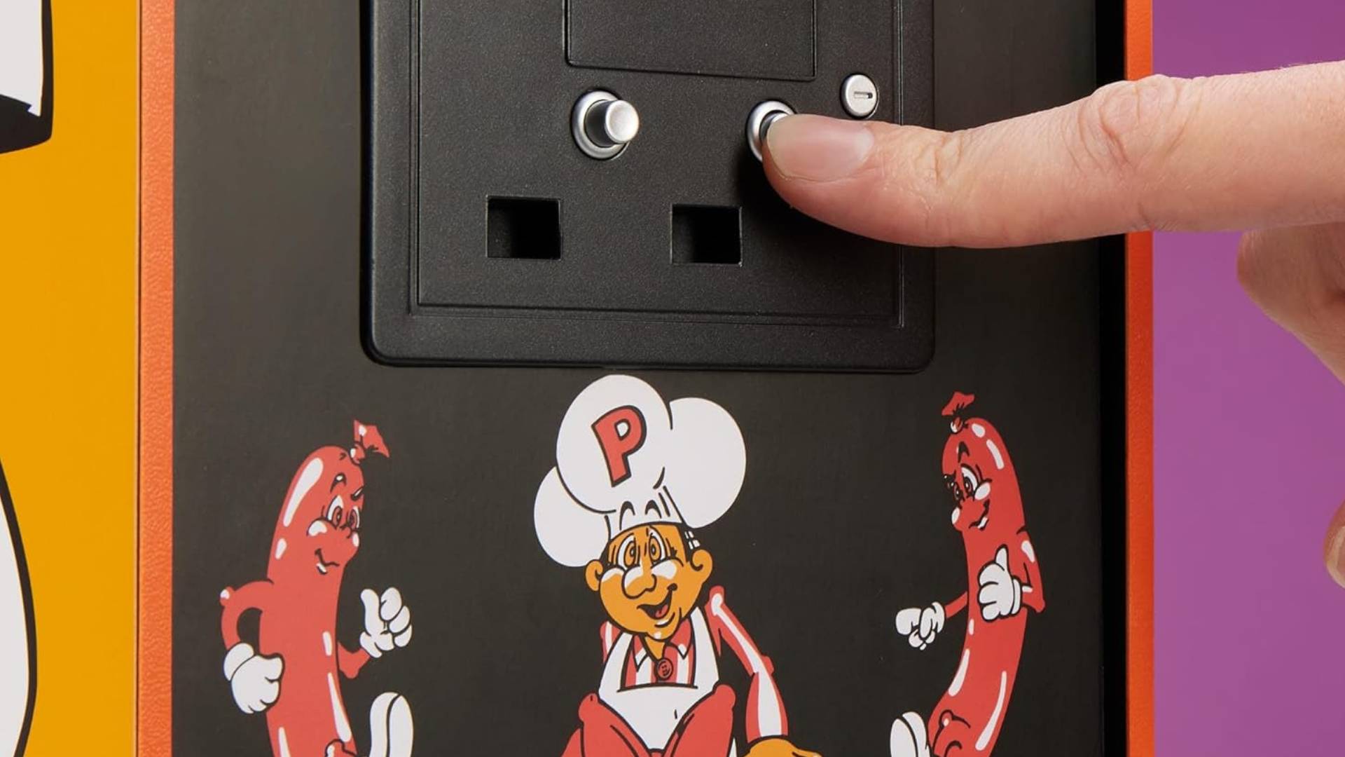 Close up of finger pressing Quarter Arcades Burger Time coin button