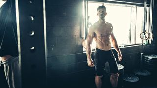 a photo of a man with abs in the gym