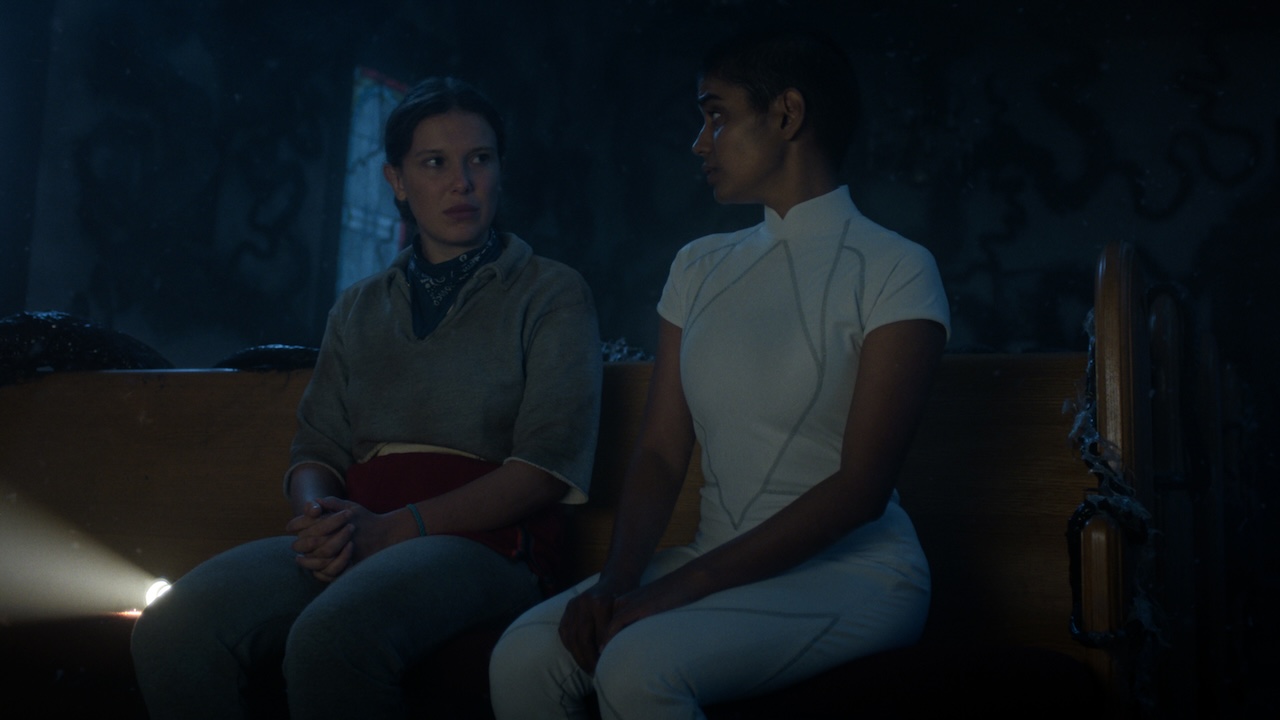 El and Kali talking in the Upside Down church in Stranger Things Season 5x05