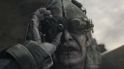 Dr Gideon adjusts his helmet and goggles in Resident Evil Requiem