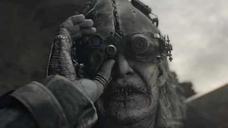 Dr Gideon adjusts his helmet and goggles in Resident Evil Requiem