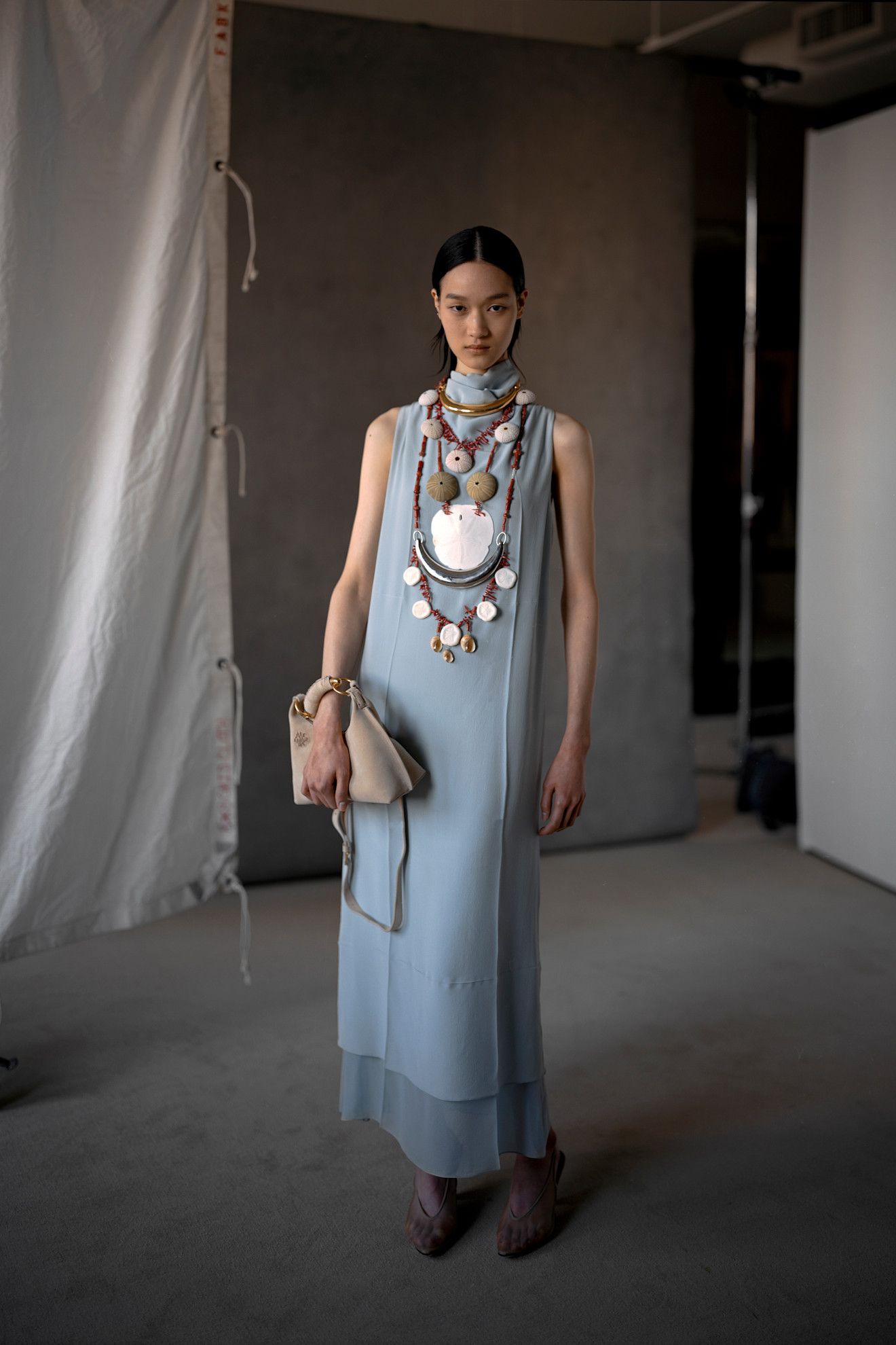 Model wears the baby blue color trend on the runway.