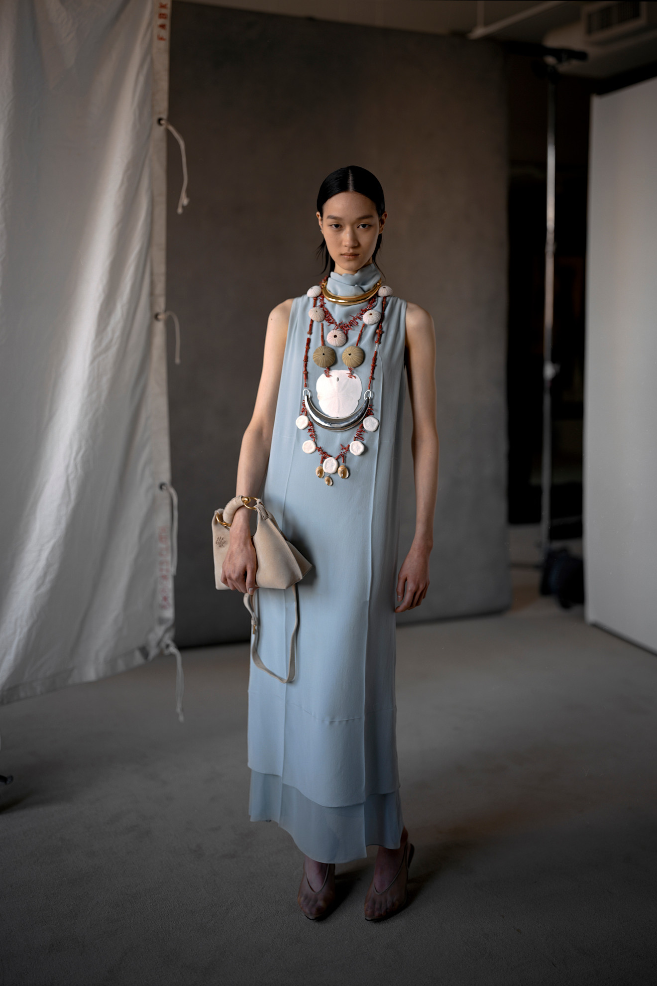 Model wears the baby blue color trend on the runway.