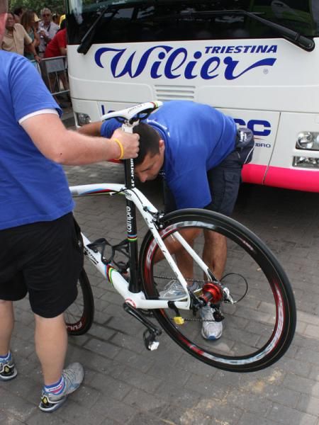 No need for a repair stand when there are two mechanics on hand.