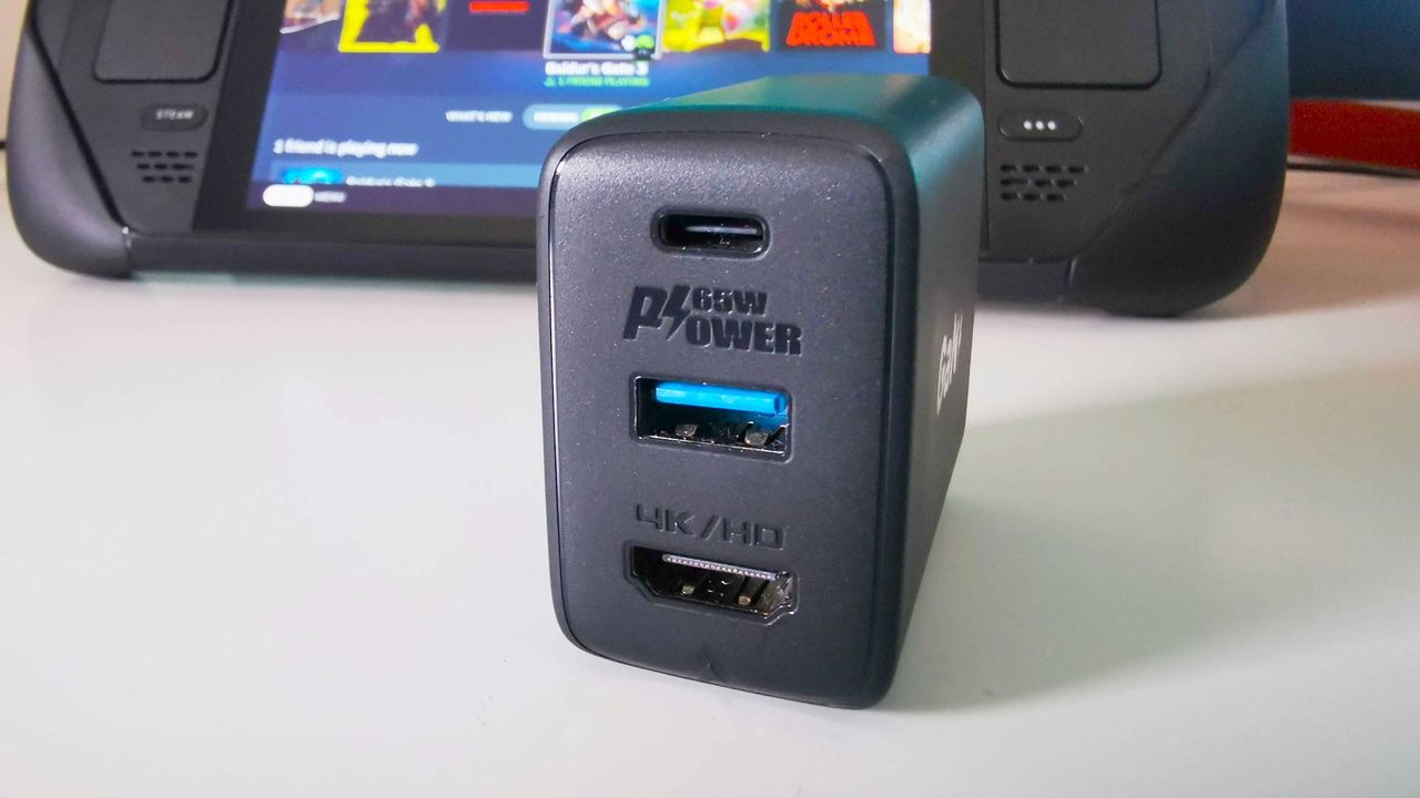 Acefast GaN PD Charger hub with Steam Deck in backdrop and ports facing camera