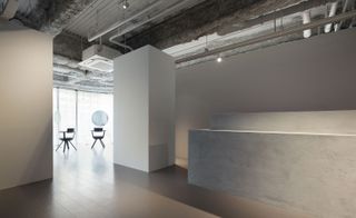 The minimalist, concrete beauty bar at Flux hair salon, designed by Sides Core