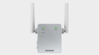 Image of the Netgear AC750 Wi-Fi range extender on a grey background.