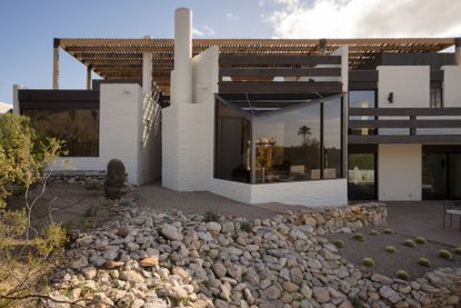 view of Ramada House by Judith Chafee, white, simple modernist house in the american desert