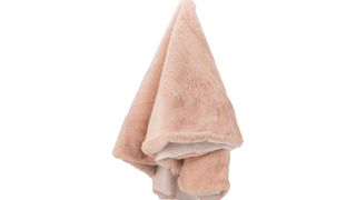 A faux-fur Christmas tree skirt from The Range in blush pink.