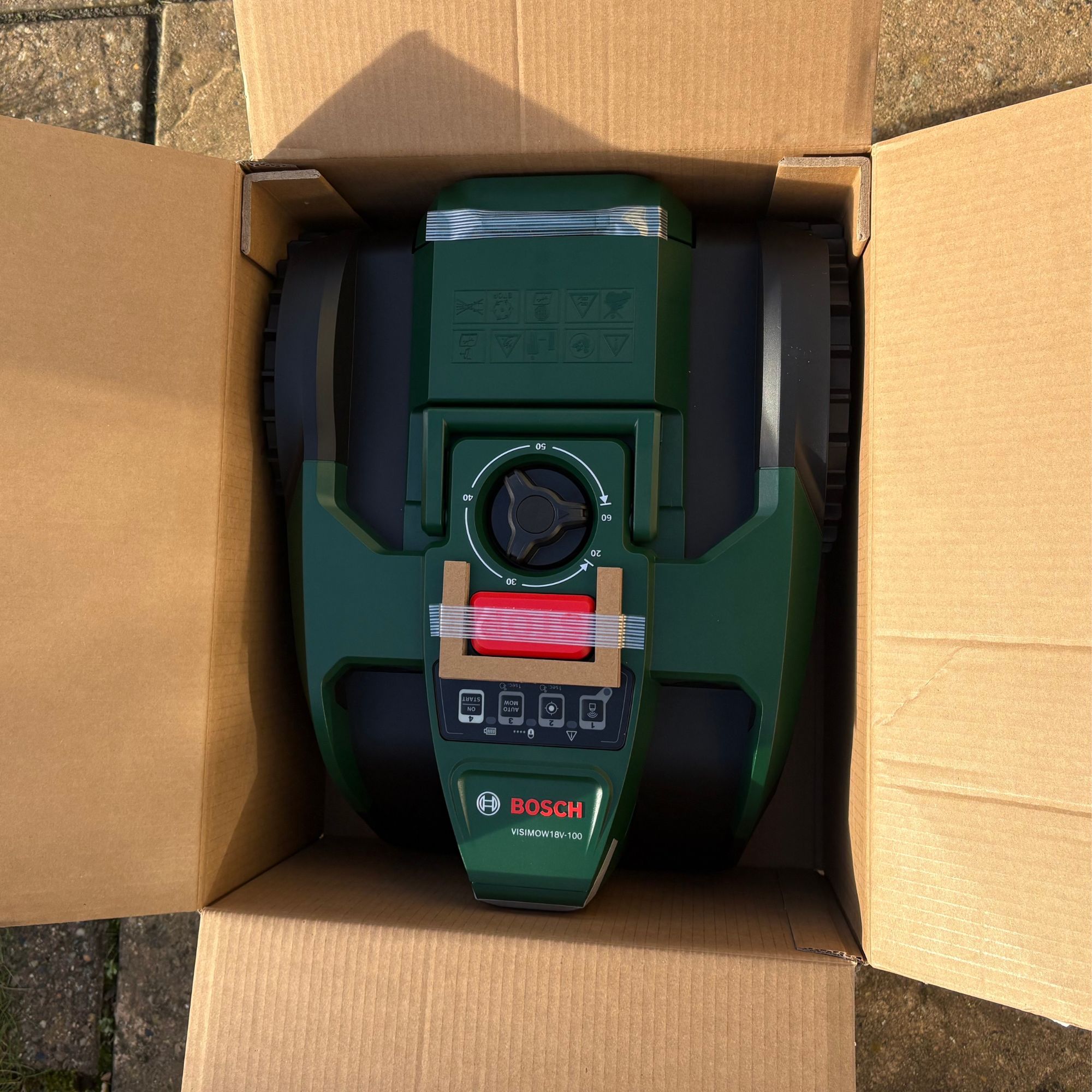 Bosch VISIMOW18V-100 Robot Lawn Mower in cardboard box packaging