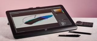 The XPPen Artist Pro 19 Gen 2, showing a drawing of a magpie feather, plus its shortcut key remote, X3 Pro Roller Stylus and X3 Pro Slim Stylus in front of a pink background.