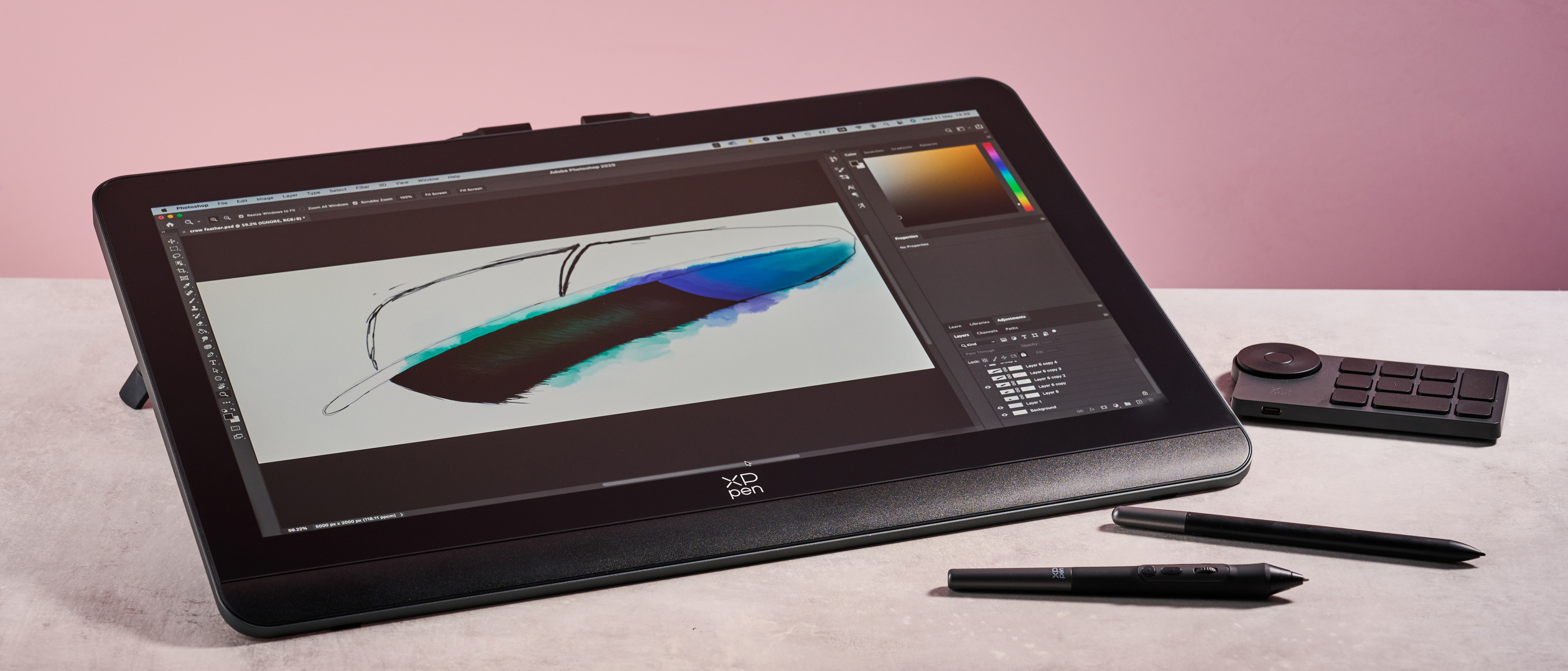 The XPPen Artist Pro 19 Gen 2, showing a drawing of a magpie feather, plus its shortcut key remote, X3 Pro Roller Stylus and X3 Pro Slim Stylus in front of a pink background.