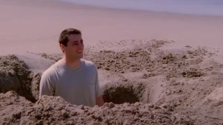 Matt LeBlanc as Joey, standing in a hole on the beach on Friends