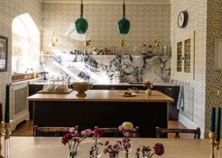 kitchen with wallpaper all over and marble splashback