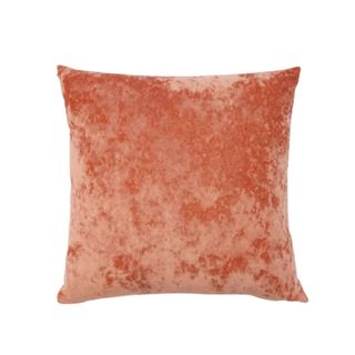 An orange velvet pillow