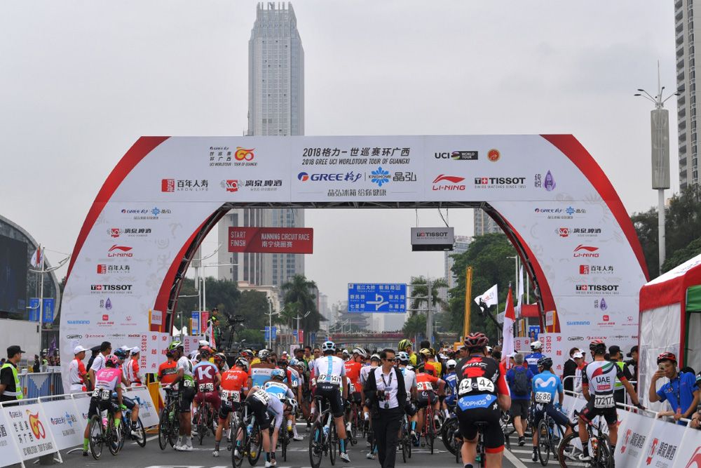 Riders line-up for the start in Nanning