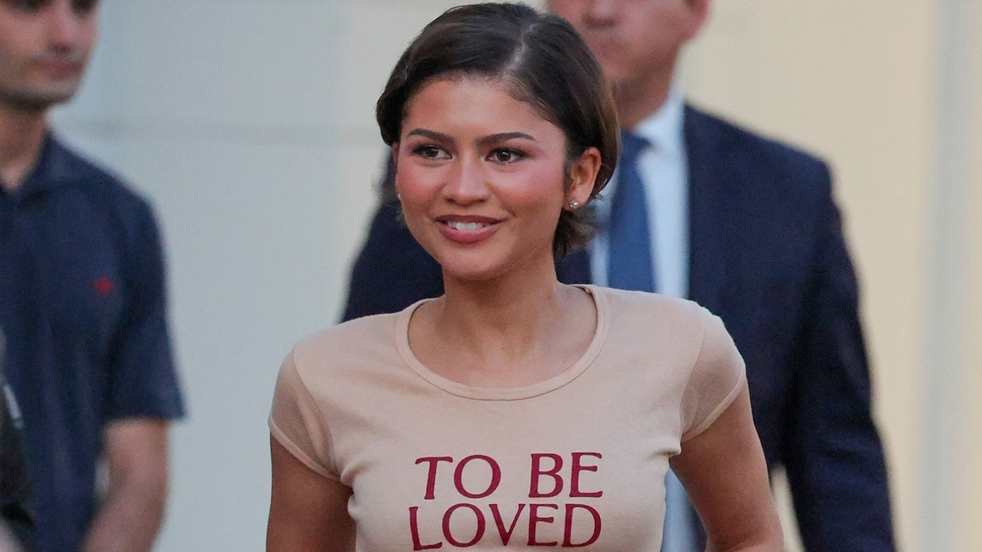 Zendaya wore the graphic tee trend with a lace-trimmed skirt and burgundy loafers