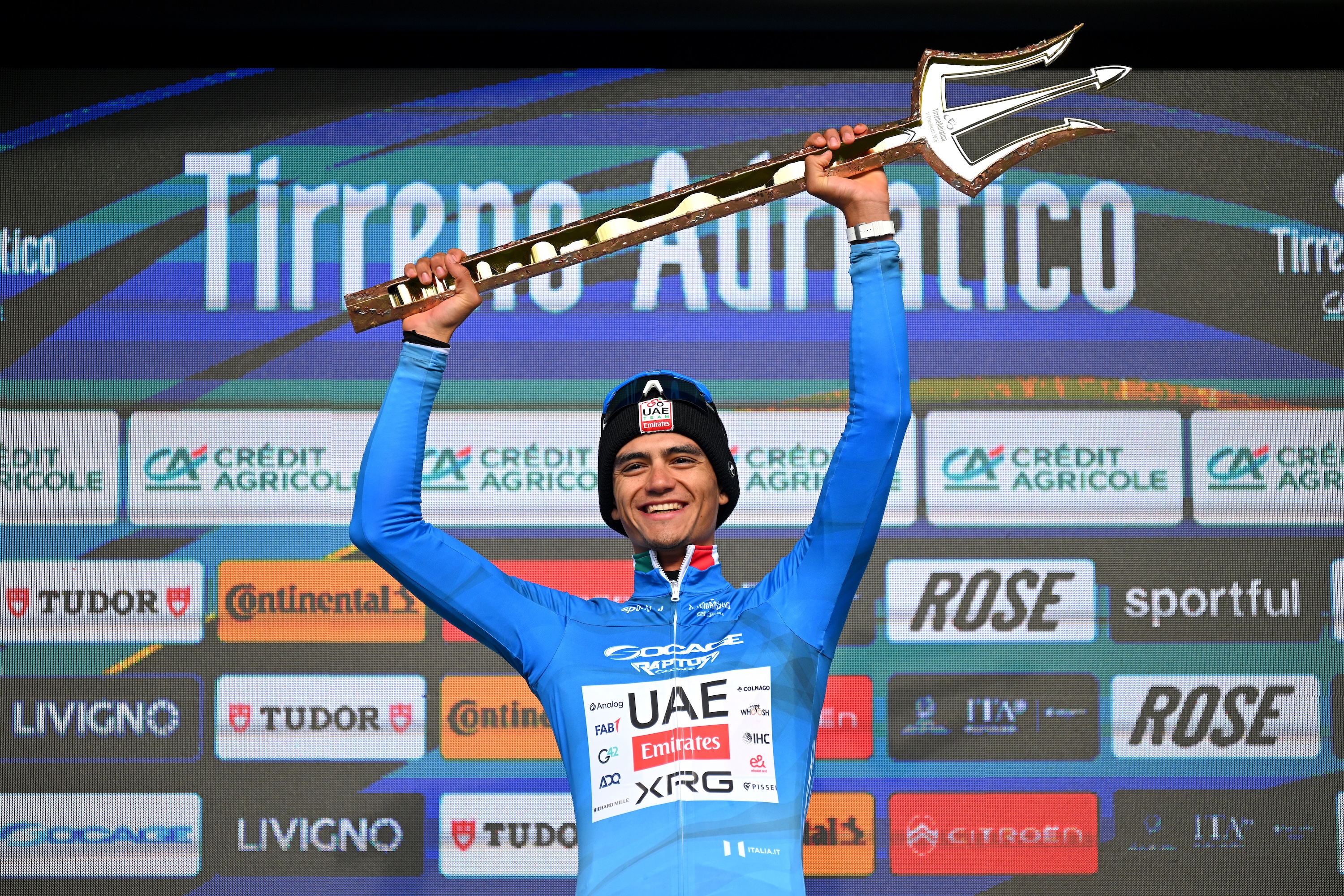 SAN BENEDETTO DEL TRONTO, ITALY - MARCH 15: Isaac Del Toro of Mexico and UAE Team Emirates - XRG celebrates at podium as Blue Leader Jersey winner with the Trident Race Trophy during the 61st Tirreno-Adriatico 2026, Stage 7 a 142km stage from Civitanova Marche to San Benedetto del Tronto / #UCIWT / on March 15, 2026 in San Benedetto del Tronto, Italy. (Photo by Tim de Waele/Getty Images)