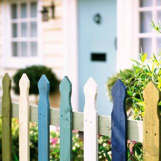 front garden with multi coloured picket fence
