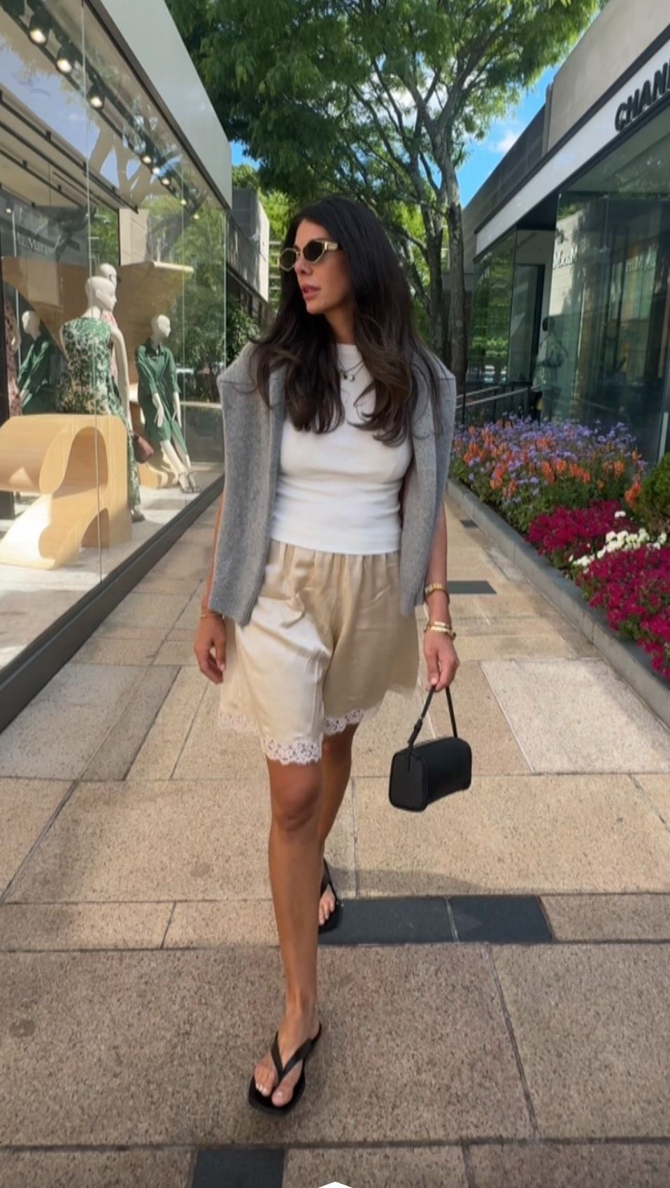 Satin Bermuda Shorts summer 2026 worn by Barbara Ferguson. She wears a butter yellow lace trim pair.