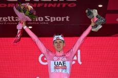 Tadej Pogačar on the podium in the Maglia Rosa after stage nine of the Giro d'Italia
