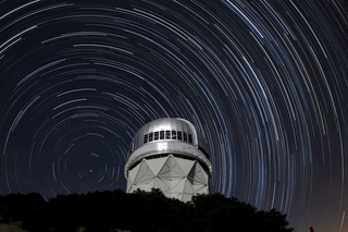 Star trails are seen over the Nicholas U. Mayall 4-meter Telescope on Kitt Peak National Observatory near Tucson, Arizona.