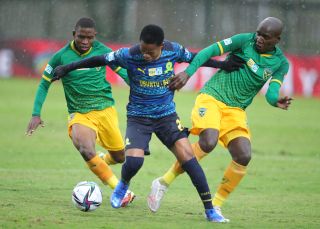 Promise Mkhuma challenged by Lindokuhle Mtshali and Michael Gumede 