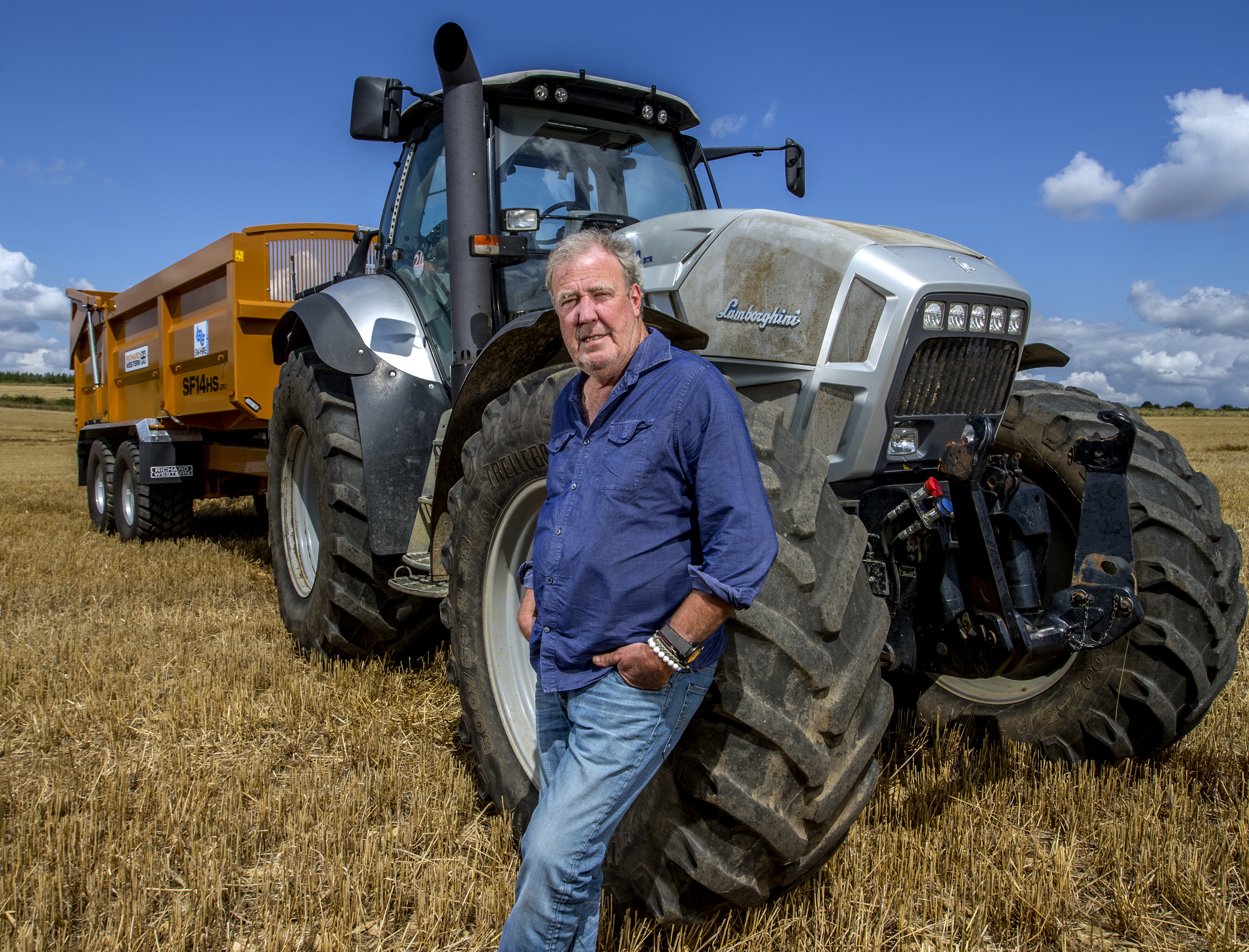 Jeremy Clarkson in front of a tractor.